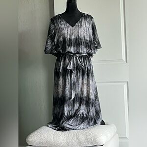 Beautiful flowing black dress with flounce sleeves.